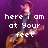 A four- shows a person with long hair playing an acoustic guitar against a purple background, with pixelated text reading "here I am at Your feet" in the top-left and "in my brokenness complete." across the other