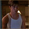 A person in a white tank top appears in four -aligned with subtle facial expression changes across the sequence
