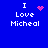 Blue background with white text reading "I Love Micheal" and four distinct pink pixelated symbols in different positions.