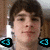Pixelated image of a person with brown hair and light skin, featuring cyan triangular shapes at the bottom left corner.
