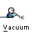 Pixelated character with white head and blue body holds vacuum cleaner, performing cleaning motion