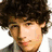 A 48x48 pixel animated contact sheet showing three sampled frames of a male character with curly brown hair in different poses and outfits against plain backgrounds.