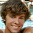 Pixelated portrait of a smiling person with brown hair on blue background, text reads "Ryan is HAWT!" in white pixel font.