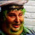 A 50x50 pixel animated buddy icon featuring two side-by-side frames: a person in a cap and green shirt on the left, and a smiling cartoon character with a hat on the right.