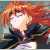 Pixelated image of a figure with long red hair, wearing dark clothing, against a multicolored background with visible pixelation and color blending.