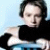A static image shows a person with short dark hair wearing a black top, holding an object against a light blue background, with four words in teal text arranged around the edges.