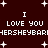 Dark red background with white pixelated text and star shapes, repeating 'I LOVE YOU' and 'HERSHEYBAR' in two