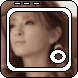 Four identical pixelated frames of a person with brown hair and large circular earrings, each framed by a gray border with white inner lines.