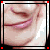 repeated close-up images showing a person's mouth and chin with a slight smile, each framed by a black border with red corner markers