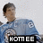 Pixelated image of a person in blue clothing with dark hair, standing against light background and black banner reading HOMEE.