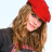 A 48x48 pixel buddy icon featuring a woman with long brown hair wearing a red beret on the left side and text reading "NEW YORK MINUTE" in stylized lettering on the right side, displayed as part of an animated contact sheet.
