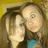 Two people with long brown hair pose closely together in a pixelated image, with pink text reading "yeahh," "be jealous," and "stay jealous" displayed around them.