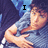 A pixelated image of a person in a blue shirt with hands over chest, text "I LOVE U ZAC" arranged across four