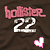 Pixelated pink 'hollister' text above white '22', two heart icons on brown background, one static and one animated.