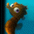 Animated pixel art of a brown cartoon character with large eyes, waving against a blue background; text reads "I'M GENNA GO TOUCH THE BUTT!" in two