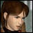 Pixelated image of a person with brown hair in a side ponytail, wearing a dark top with red accents, next to black background with white text.