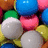 Pixelated image of colorful gum balls with white spheres and text "PoP!" on a blue sphere.