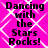 A static image displays "Dancing with the Stars Rocks!" text in black pixelated font on a bright pink background with white diamond-shaped patterns.