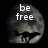 Pixelated grayscale skull with 'be free' text overlaid, set against a black background.