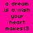 A static image with a bright pink background displays the text "a dream is a wish your heart makes<3" in black pixelated font, arranged across three