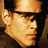 Pixelated promotional image of a man in profile with text 'S.W.A.T. IN THEATERS AUGUST 8' on the right side.