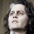 A four- shows a person with long dark hair and light skin, looking upward with a neutral expression against a muted brown background