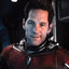 Static 64x64 pixel buddy icon showing a person in dark clothing with metallic accents against a black background, rendered at low resolution with visible dithering and color bleeding.
