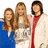 Three people stand together in a pixelated image with red text reading 'tripod=' above and names below, set against a light background.