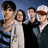 Four people pose together in a pixelated image with teal background text reading "Fall Out Boy" and "Taken over by Monkeys!" on left, "Thxks Fr Th Mns Fox" on right.