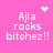 Pink background with white pixelated text 'Ajl a rocks bitchez!!' and four distinct animated symbols: heart, starburst, dots, and another starburst.