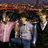 Pixelated image of three people under a large brown object with pink text reading 'Jonas Brothers' and 'Roxs My WORLD!!! I LUV THEM!!!' on black background.