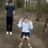 Animated sequence showing three figures on a dirt path with a red text overlay reading "MICHAEL YOU FATTY" and "YOU BROKE THE SWING".