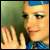 A split-screen image shows a person with blue hair and a blue checkered top on the left, and the word 'BUTTERFLY' in bold black letters on a green background on the right.
