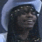 Animated contact sheet of a person in a light blue cowboy hat with dark braided hair, showing facial expression changes across six frames with overlaid text labels and red pixelated text.