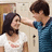 Pixelated image of two people in a school setting with text overlay on cyan background.