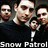 Four pixelated figures in dark clothing stand together with a smaller figure below them, text reading 'Snow Patrol' at the bottom.