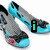 Pixelated image of two blue and gray high-heeled shoes with pink floral details, one showing a green 'i' symbol, another a green heart symbol, and the third displaying green text reading 'shoes'.