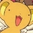 A pixelated close-up of a yellow cartoon character with large ears, a small black eye, and a wide open mouth showing a pink interior.