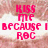 Pixelated pink text reads 'KISS ME BECAUSE I ROC' on a blurred background with white and brown tones.