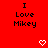 Red background with repeated "I Love Mikey" text and white pixel hearts/chevrons; gray rectangle in bottom-right corner.