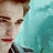 A pixelated image of a person with light brown hair and red lips, wearing a dark jacket over a striped shirt against a teal background.