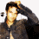 A pixelated image of a person with dark hair wearing a dark shirt, showing two sequential poses where the head moves from left to right.