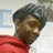 A person in a red hoodie and dark cap appears in four -aligned with slight head position shifts
