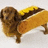 A pixelated dog in a hotdog bun costume stands on a white background with red text reading 'hi' to the right.