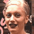 Static 50x50 pixel icon showing a close-up of a person's face with light skin tone, short hair, and visible facial features including eyes, nose, mouth, and ear, rendered in low-resolution pixel art style with warm color palette.
