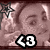 A pixelated image of a person with light brown hair and closed eyes, featuring text overlays including '<3' and 'DEEP OUT', surrounded by star-shaped symbols.