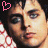A 48x48 pixel buddy icon featuring a side-by-side contact sheet of two animated frames showing the same person with different heart symbols above their head, set against a red and white patterned background.