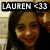 Static pixelated image of a person with long dark hair, wearing a dark top, with a black banner displaying 'LAUREN <33' at the top.