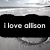 Black rectangular banner with white text reading 'I love allison' on a pixelated gray background with horizontal light streaks.