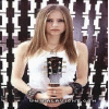 identical repeated images showing a person holding a guitar, overlaid with yellow text fragments